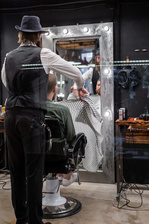 Free Photo of a Barber Giving a Haircut Stock Photo