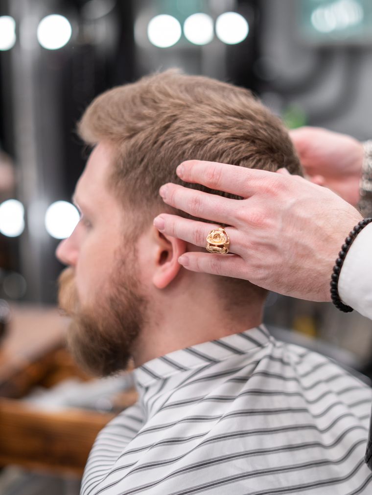 Barber giving a haircut in a barbershop