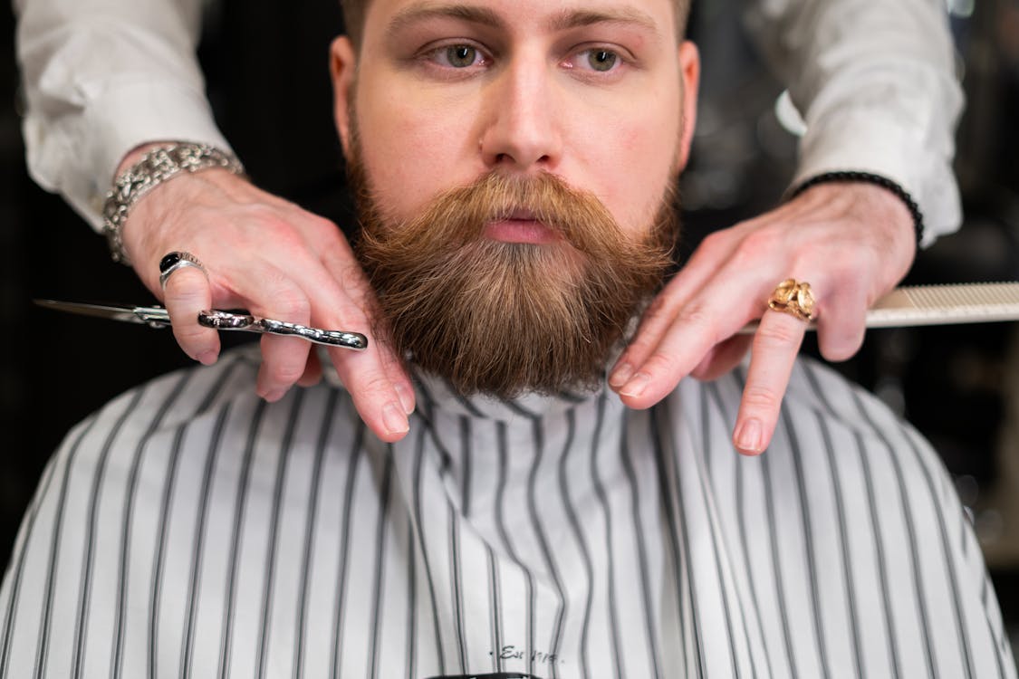 Free Man in White and Gray Pinstripe Having a Haircut Stock Photo