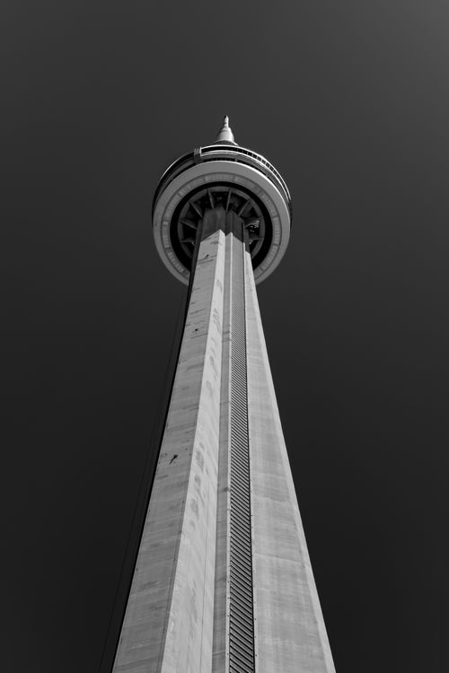 Free Upward perspective of Toronto's iconic CN Tower in black and white against a clear sky. Stock Photo
