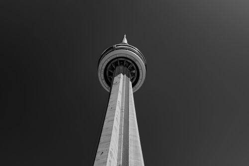 Free Black and white photo of the CN Tower in Toronto from a unique low angle perspective. Stock Photo
