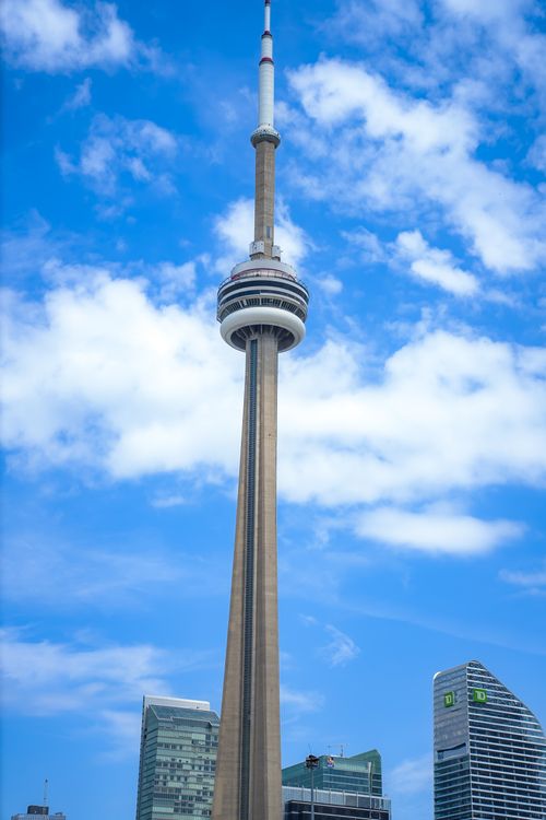 Free CN Tower rising prominently against a clear blue sky in Toronto, Canada. Stock Photo