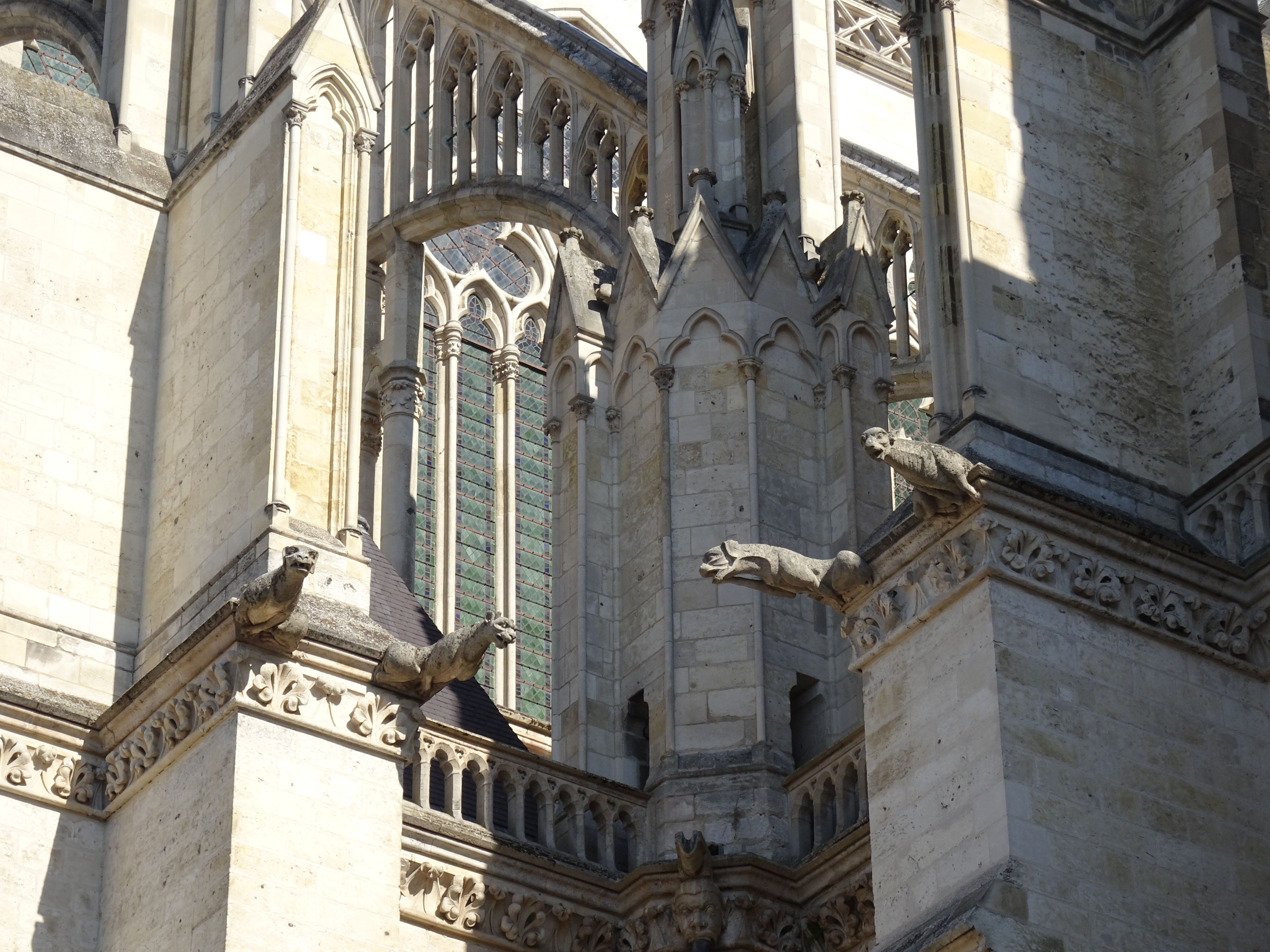 Detail of gothic gargoyles on the facade of Amiens Cathedral, France.