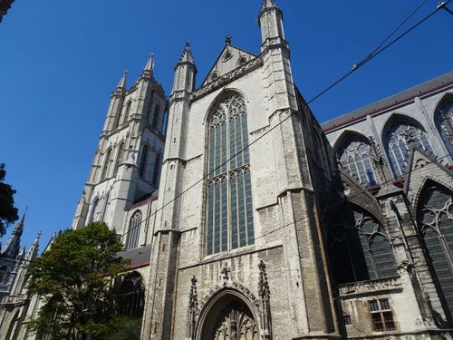 Free Stunning medieval architecture of Saint Bavo's Cathedral in Ghent, Belgium on a sunny day. Stock Photo