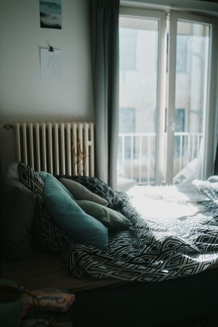 Pillows on a bed in soft morning light