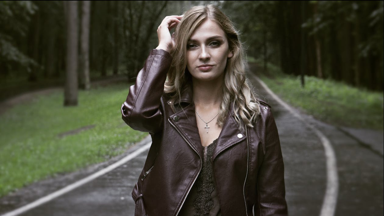 Free Woman In Leather Jacket Standing On Road Stock Photo