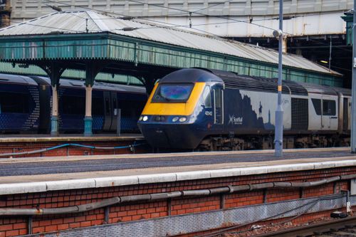 Free A Scotrail train is seen at a platform in a historic Scottish railway station. Stock Photo