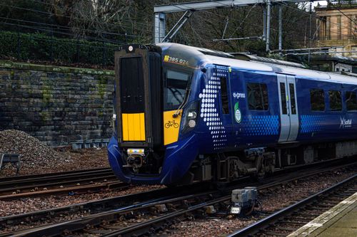 Free A sleek ScotRail train at a station in Scotland. Captured outdoors, emphasizing modern transport. Stock Photo