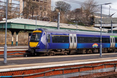 Free A modern train at Edinburgh Waverley Station in Scotland on a clear day. Stock Photo