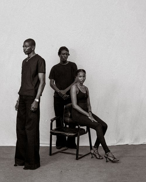 Free Artistic black and white portrait of three adults posing together. Stock Photo