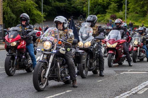 Free Bikers ride through Morpeth, England in a vibrant motorcycle rally, showcasing camaraderie and spirit. Stock Photo