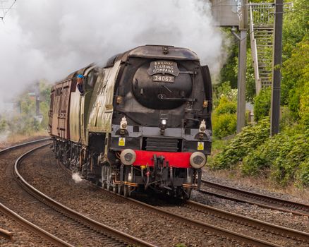 A classic steam locomotive from Railway Touring Company on a picturesque route.