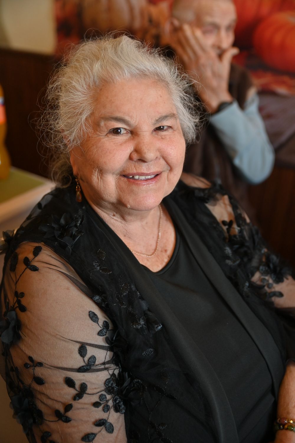Resident smiling during a one-to-one care visit