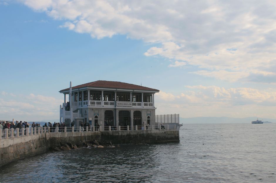 Beautiful day at Moda Iskele in Istanbul with crowds enjoying the waterside view.