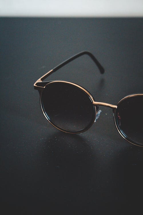 Free Sunglasses On Black Surface Stock Photo