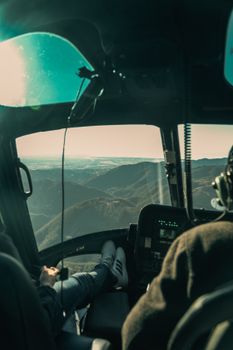 Experience a helicopter view of majestic mountains, capturing adventure and tranquility.