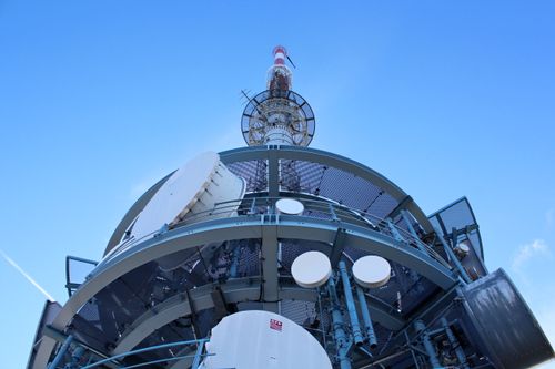 Free A broadcasting tower in Arth, Switzerland, under a clear blue sky, captured from below. Stock Photo