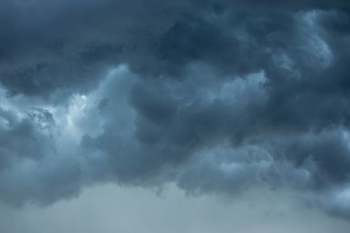 Free Moody storm clouds gather over Campbelltown in New South Wales, Australia, casting a dramatic atmosphere. Stock Photo