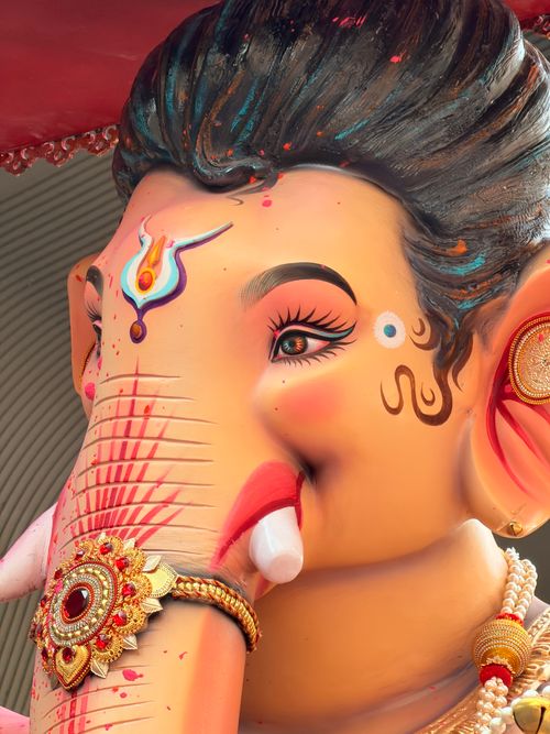 Free Close-up of a colorful Ganesha idol showcasing intricate decorative elements. Perfect for cultural themes. Stock Photo