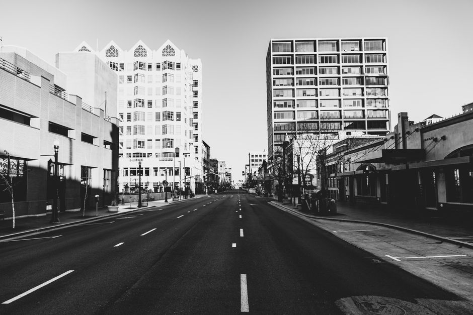 Black and white view of downtown Boise, Idaho featuring urban architecture and an empty street.