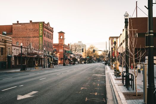 A quiet early morning on an empty street in downtown Boise, Idaho, showcasing historic architecture.