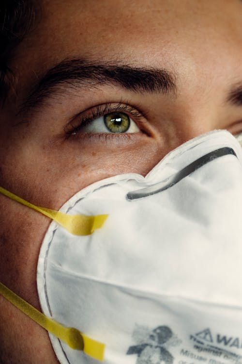 Free Person Wearing White Face Mask Stock Photo