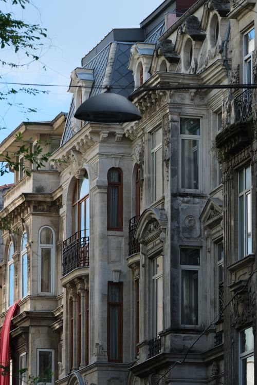 Free Detailed view of neoclassical European building facade with ornate details. Stock Photo