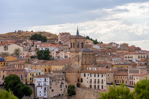 Free Charming view of Valencia's historic rooftops and ancient architecture under a cloudy sky. Stock Photo