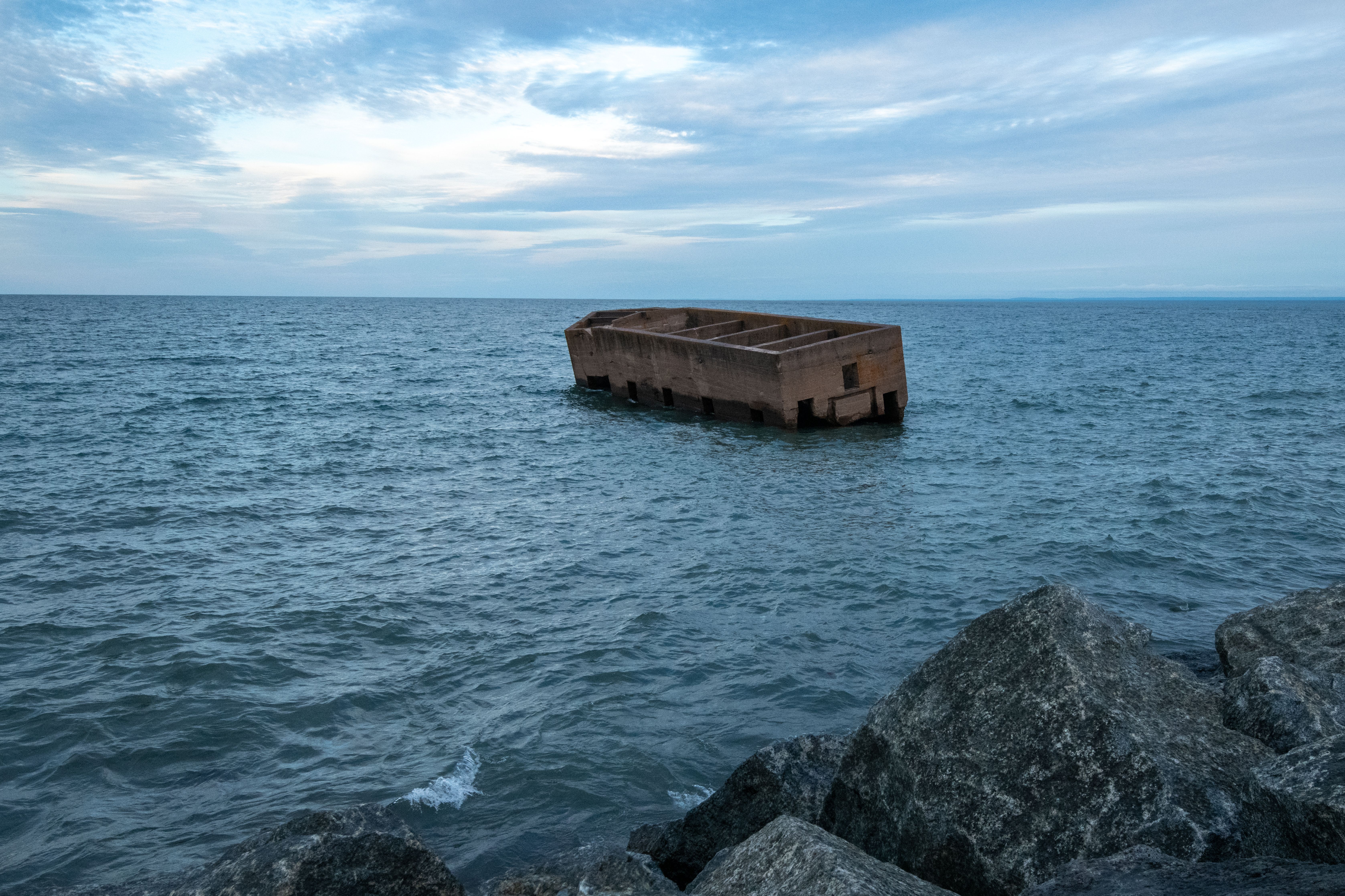 An old concrete structure floats near the shore of Lake Superior in Duluth, Minnesota.