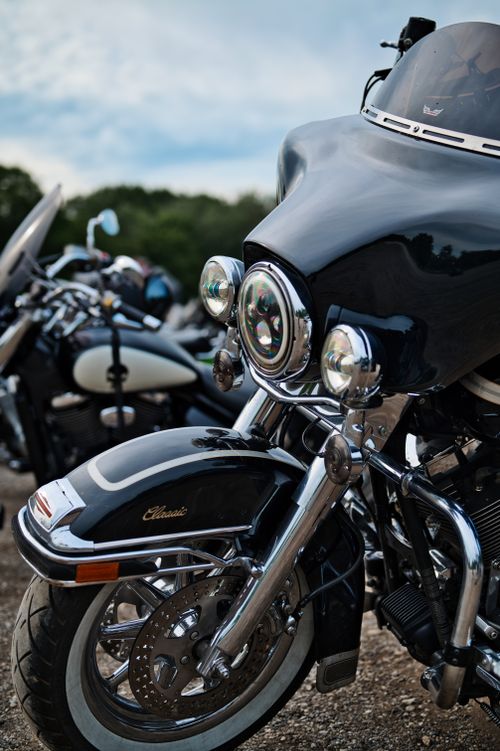 Free Close-up view of a classic touring motorcycle parked outdoors with clear skies. Stock Photo