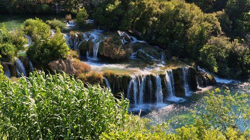 Free Beautiful cascade at Krka National Park with lush greenery and tranquil water flow. Stock Photo