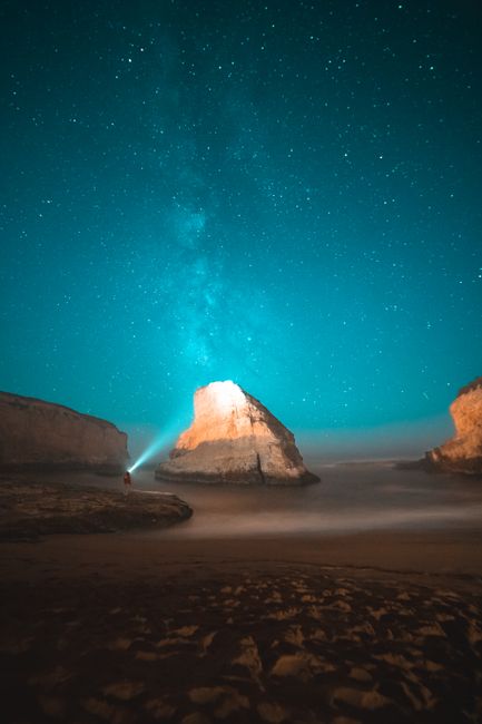 Stunning night sky with Milky Way over Shark Fin Cove, Davenport, CA.