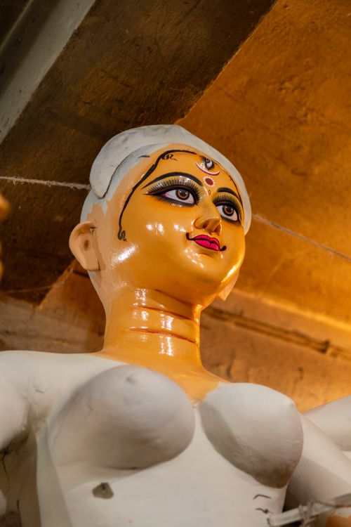 Free Vibrant Indian goddess statue under construction in an artisan workshop, showcasing cultural artistry. Stock Photo