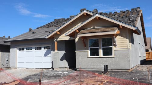 Free A newly built modern house under construction with garage and roof work. Stock Photo