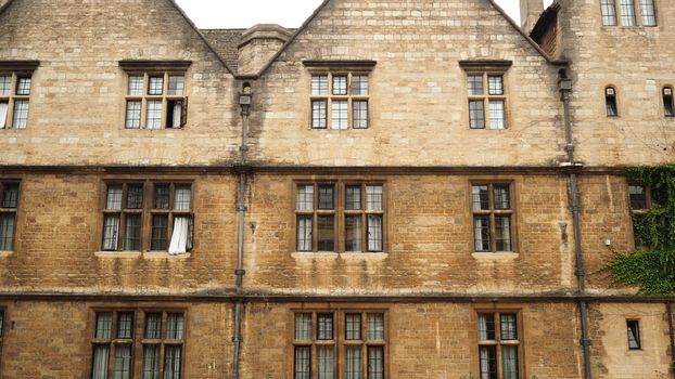 Close-up of a historic stone building facade with symmetrical windows, exuding classic charm.