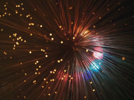Abstract background with multicolored beams and bokeh effect
