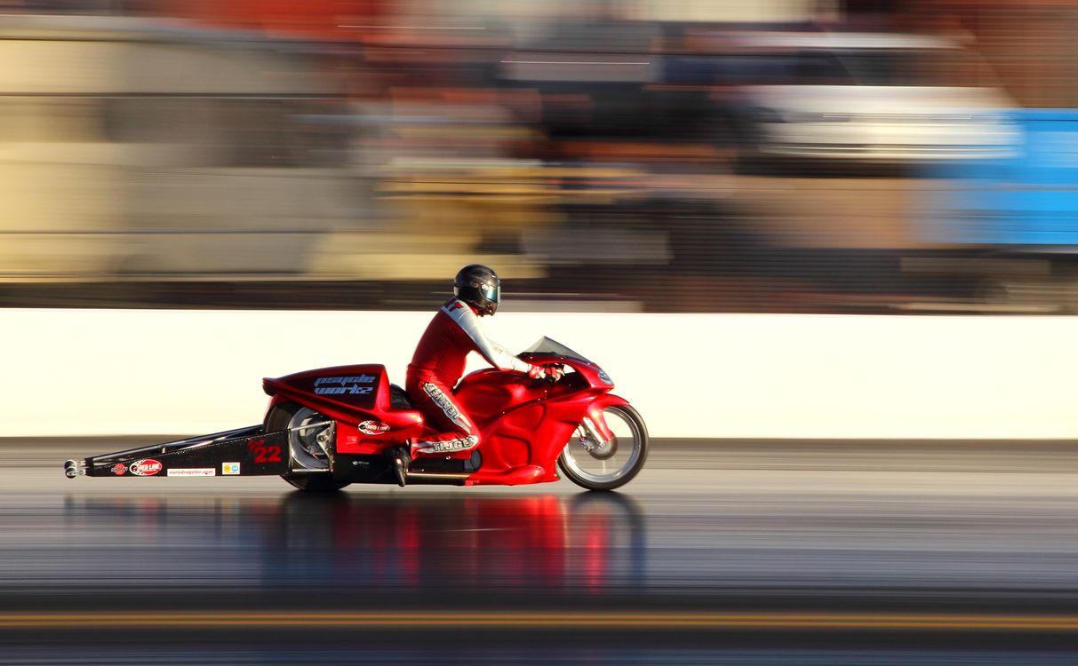 Person Riding Bike Red Man Riding Red Sports Bike · Free Stock Photo
