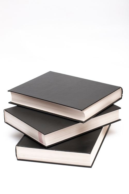 Free Minimalist stack of black books showcasing simplicity and academic focus. Stock Photo