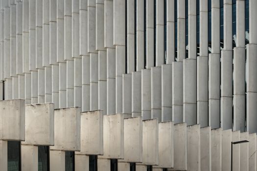 Dynamic architectural facade featuring repeating geometric patterns and modern design.