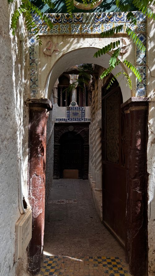 Free A traditional archway in the historic Casbah of Algiers, showcasing ornate tilework. Stock Photo