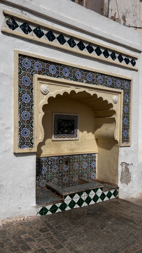 Free Colorful, intricate tile fountain in the historic Casbah of Algiers, showcasing Algerian design. Stock Photo