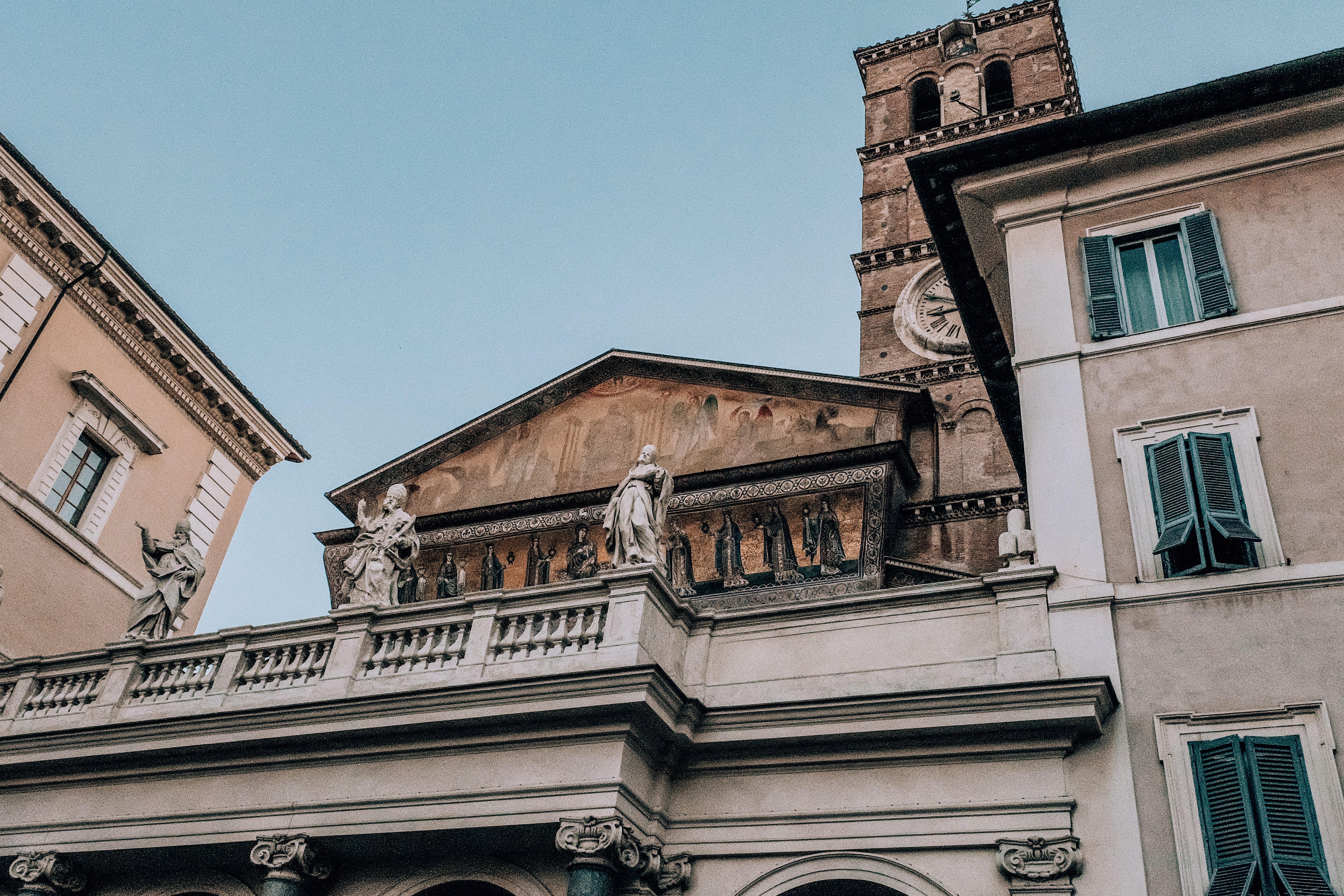 Facade of old building decorated with sculptures under blue sky · Free ...