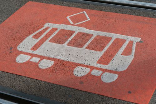 Free Tram sign on red pavement indicating tramway location. Stock Photo