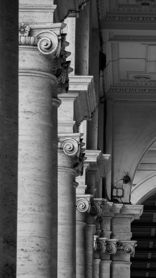 Free Elegant black and white image showcasing classical stone columns in a row. Stock Photo