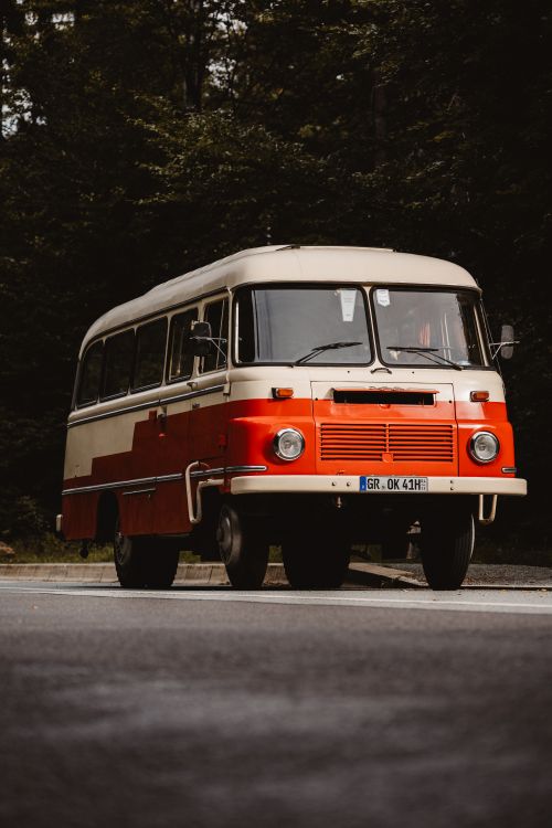Free A classic vintage bus parked in the scenic greenery of Großschönau, Sachsen, Germany. Stock Photo