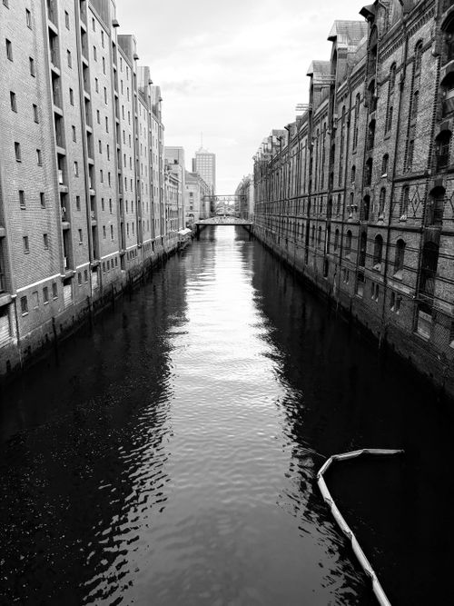 Free Black and white view of the iconic Speicherstadt canal in Hamburg, Germany. Stock Photo