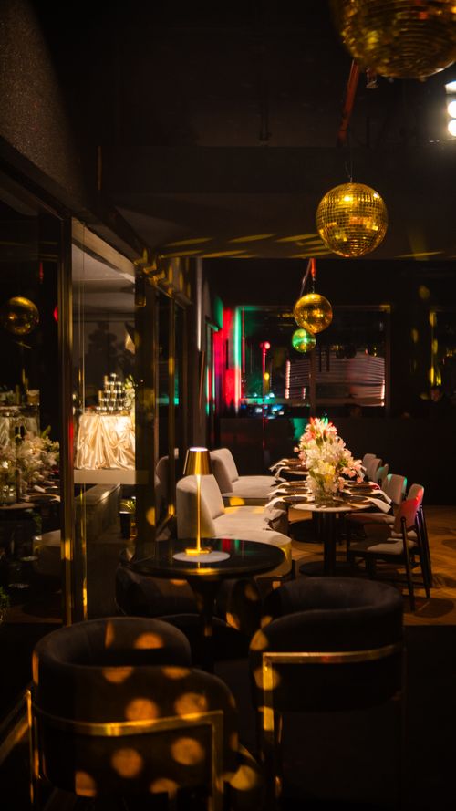 Free Elegant nightclub with stylish decor, disco balls, and festive atmosphere. Perfect for chic gatherings. Stock Photo