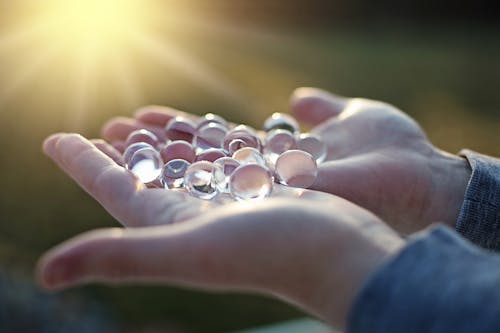 Free Person Holding Bunch of Crystal Balls Stock Photo