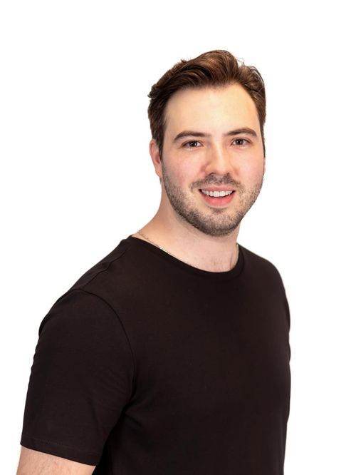 Free Friendly portrait of a man in black shirt with white background. Stock Photo