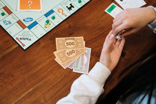 Fake Money on Brown Wooden Surface 